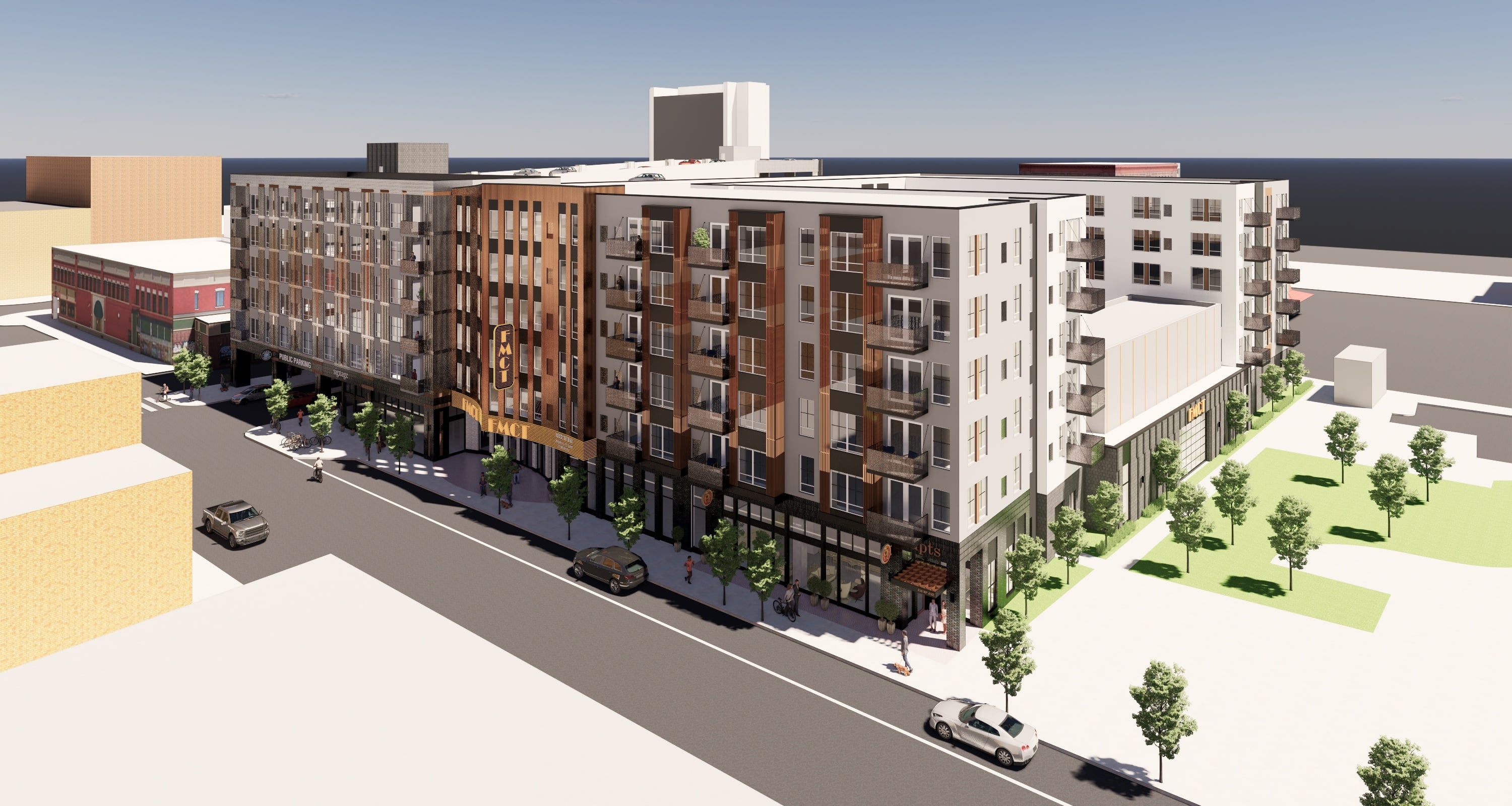 A rendering of a modern apartment complex with a street view.